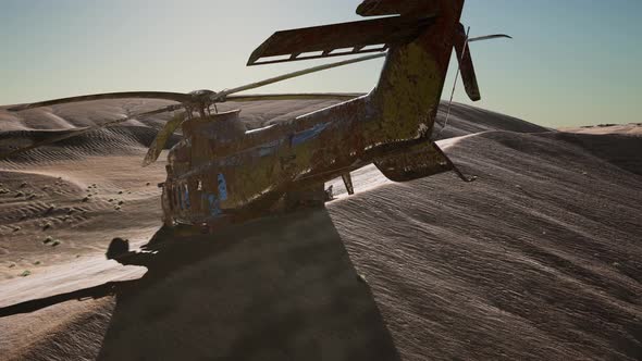 Old Rusted Military Helicopter in the Desert at Sunset