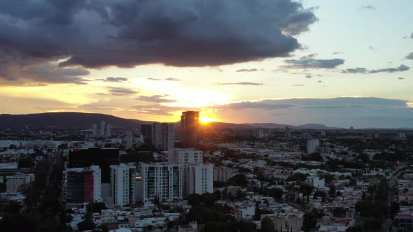 The sunset through the building.