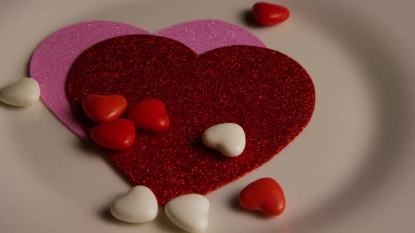 Rotating stock footage shot of Valentines decorations and candies - VALENTINES 0098