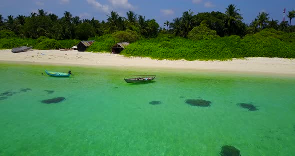 Luxury drone island view of a paradise sunny white sand beach and aqua turquoise water background in