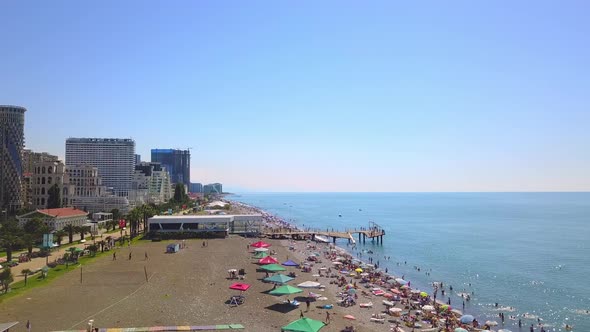 Aerial view on beach and umbrellas. Beach and blue water.