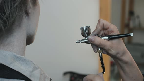 SFX Makeup Artist with Airbrush Machine Working with Actor