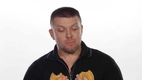 Man Eats a Cheeseburgers. White