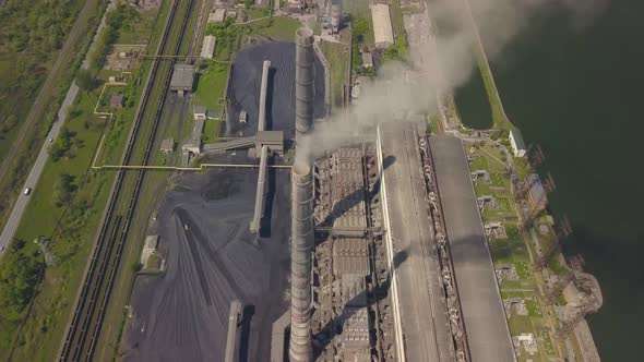 Chimneys of a Thermal Power Plant. Shooting From the Height of an Energy Object Running on Fossil