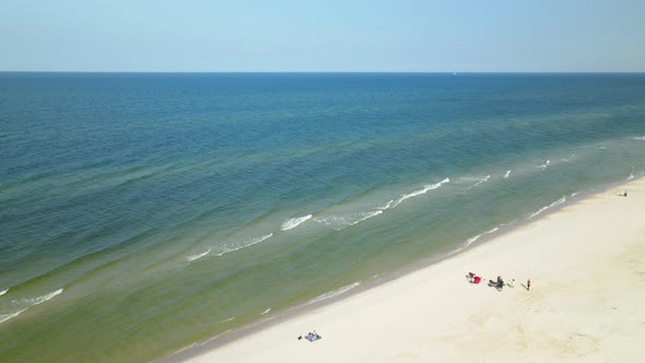 Aerial seascape. Drone flying towards waving sea on the shoreline of Baltic Sea