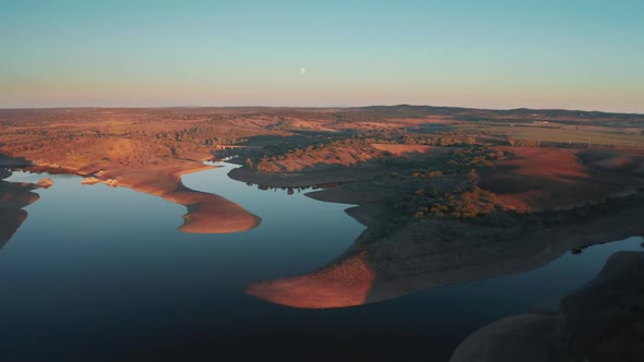 Aerial View of the Sun Setting Beyond the Horizon in Beautiful Countryside Area