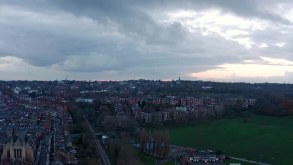 Aerial rotating drone shot over residential buildings in north London Hampstead heath evening