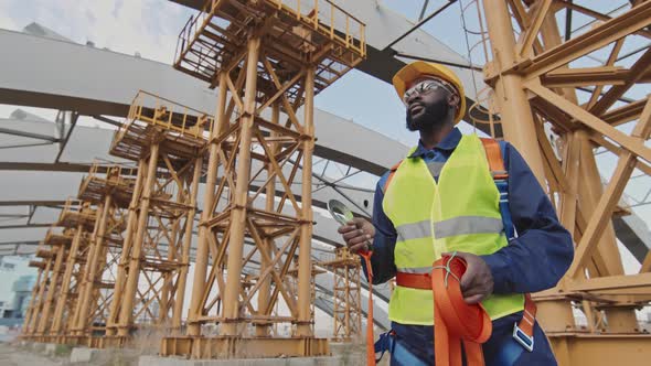 Construction Worker Holding Safety Belt Harness