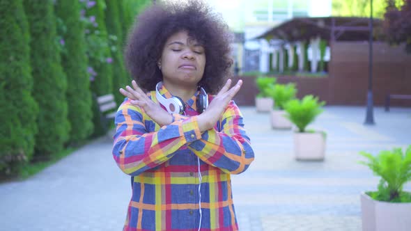 African Woman with an Afro Hairstyle Shows Denial