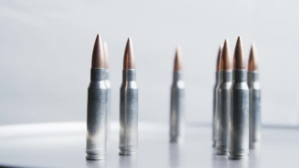 Cinematic rotating shot of bullets on a metallic surface - BULLETS 023