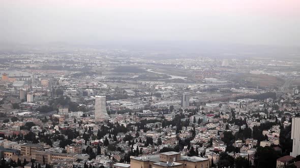 Beautiful evening view of the city of Haifa from the mountain. Large Israeli port