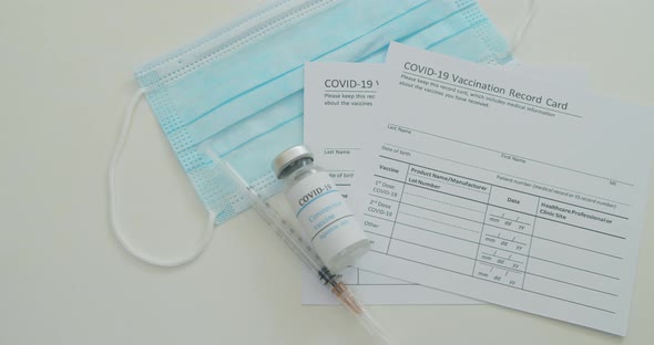 Medical Mask and COVID19 Vaccine on Vaccination Record Card Approved By CDC with Corona Virus