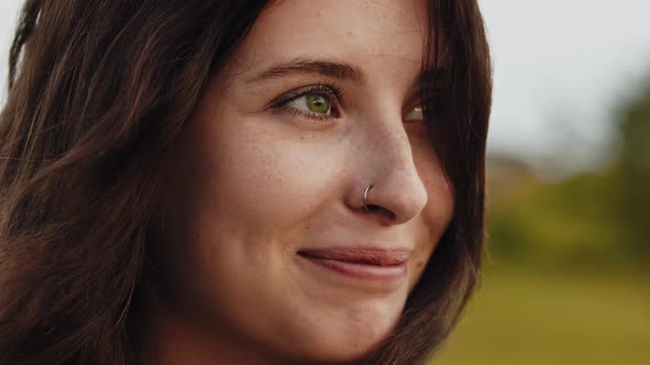 Young Beautiful Smiling Woman with Green Eyes