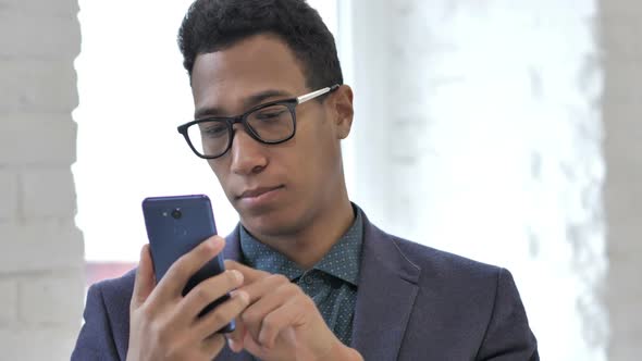 Young Girl Using Smartphone at Workplace