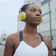 Young woman with headphones in city, Milan, Italy - VideoHive Item for Sale