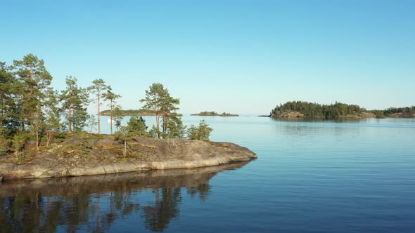 Aerial view on the lake and Islands with rocky coastline and forest in Karelia