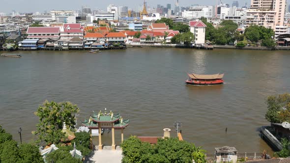 Oriental Boat Floating on River in Krungthep City