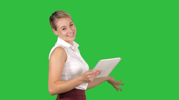 Female Office Clerk Walking with Tablet and Smiling Broadly