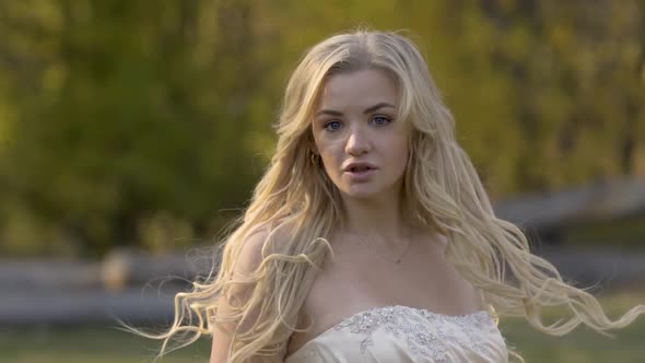 Bride Stands with Her Back To Camera, Then Turns with Surprised Wow Face Expression. Slow Motion.