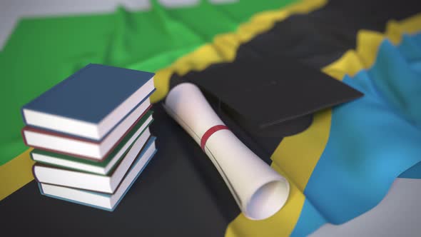 Graduation Cap and Diploma on the Flag of Tanzania alt
