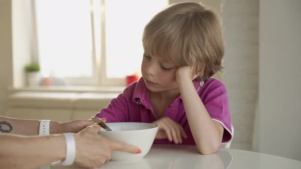 7 Year Old Caucasian Boy Refuses To Eat Soup. Child Hate Soup