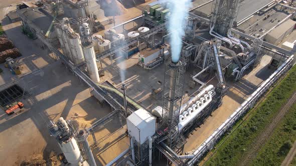 Aerial View of Wood Processing Factory with Stacks of Lumber at Plant Manufacturing Yard