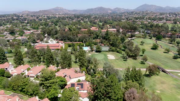 Aerial View of Residential Neighborhood Surrounded By Golf in Green Valley