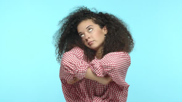 Slow Motion of Moody Girlfriend with Long Curly Hair Looking Upset and Offended Cross Arms on Chest