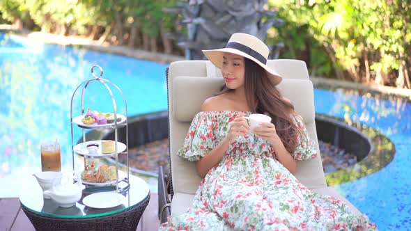 Young asian woman with coffee cup