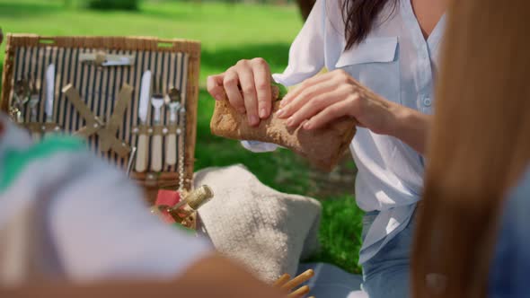 Mother Share Sandwich Between Children on Picnic