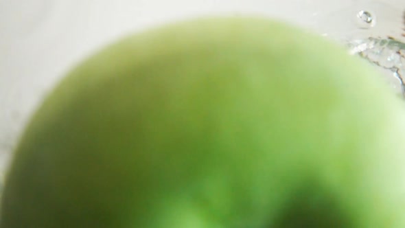 Green Apple Drop Down In Water