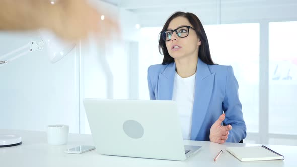 Woman Reacting to Angry Boss at Work