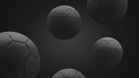 Black soccer ball falling in slow motion, looped switch