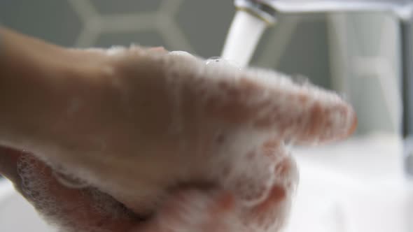 Close Up of Woman Washing Hands with Soap Foam