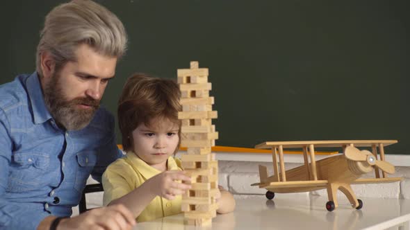 Father and Kid Playing Blocks Together