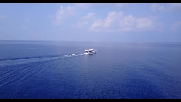 Aerial above nature of exotic coastline beach wildlife by transparent ocean with white sand backgrou