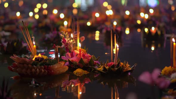 Lots of Krathongs Floating on the Water. Celebrating a Traditional Thai Holiday - Loy Krathong