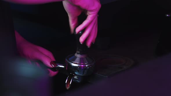 Barista Forms a Tablet in the Holder for Making Espresso