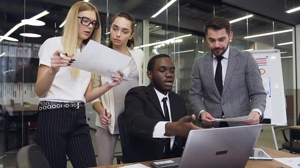 Young Business Colleagues which Working Together Under Business Project