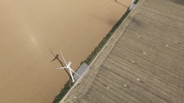 Wind Turbines Generating Lot Energy in Golden Fields, Aerial Survey