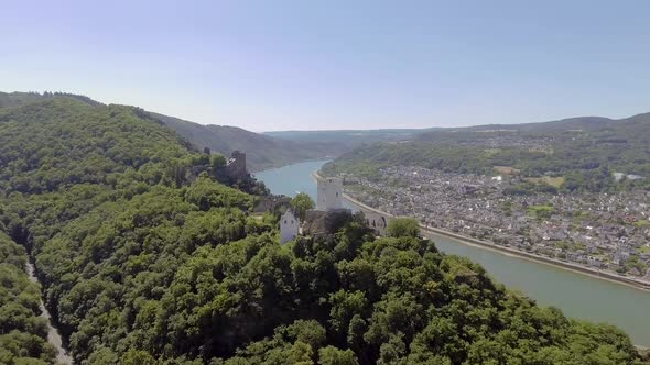 Drone flight in nature with beautiful view on a castle and a river.
