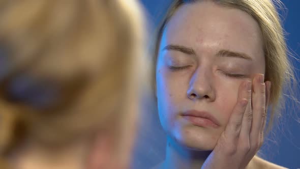 Female Teenager Looking at Reflection in Mirror, Low Self-Esteem in Young Age