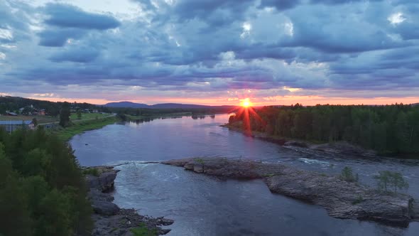 Aerial view of a lake at sunset in Overtornea, Sweden.