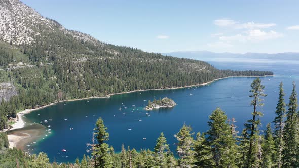 Wide rising aerial shot of Emerald Bay in Lake Tahoe. 4K