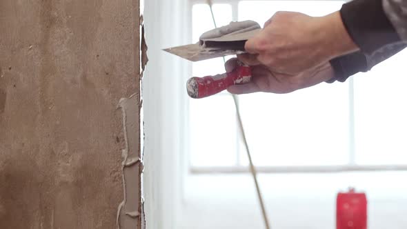 Male Caucasian Middleaged Worker Laying on Liquid Cement on Wall in Slowmotion