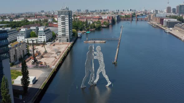 Forwards Descending Fly Towards Molecule Man Near Bank of Spree River