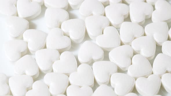 Macro White Heart Shape Drugs Closeup Medical Pills Rotating Medicine Concept