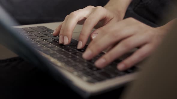 Close Up of Female's Hands Typing on Laptop
