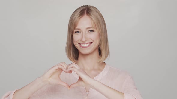 Studio portrait of young, beautiful and natural blond woman.