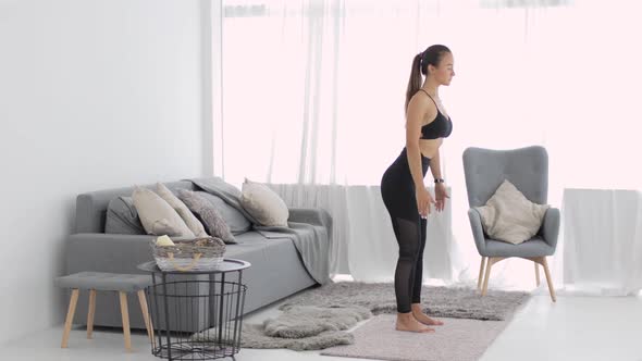 Woman Warming Before Yoga Practice and Doing Slopes Forward, Camera in Motion.